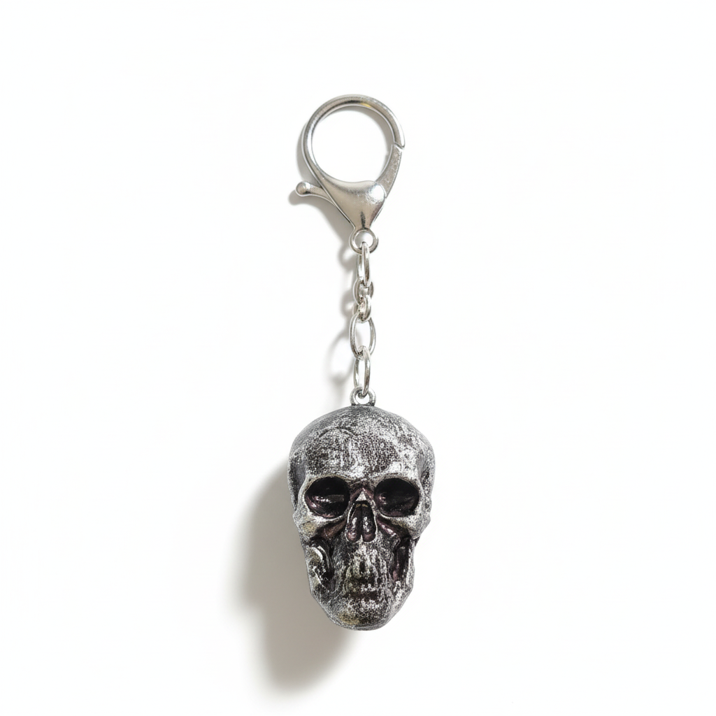 Silver skull keychain - handmade polymer clay gothic accessory on white background