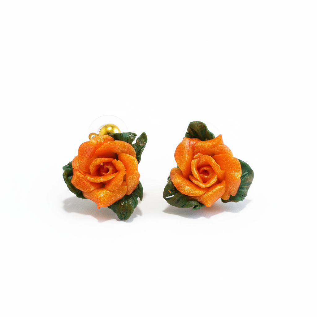 Polymer clay earrings with orange roses on white background